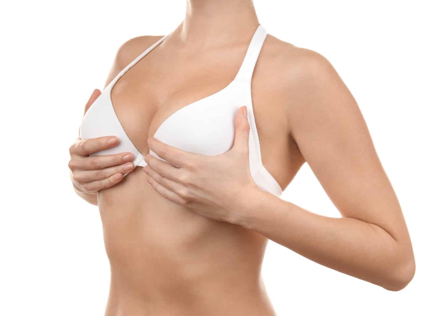 Plastic surgery concept. Woman in white bra, closeup Breast Lift Cleveland OH